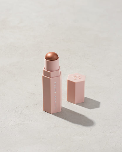 Match Stix Shimmer Skinstick shown in shade Sinamon on a concrete background.