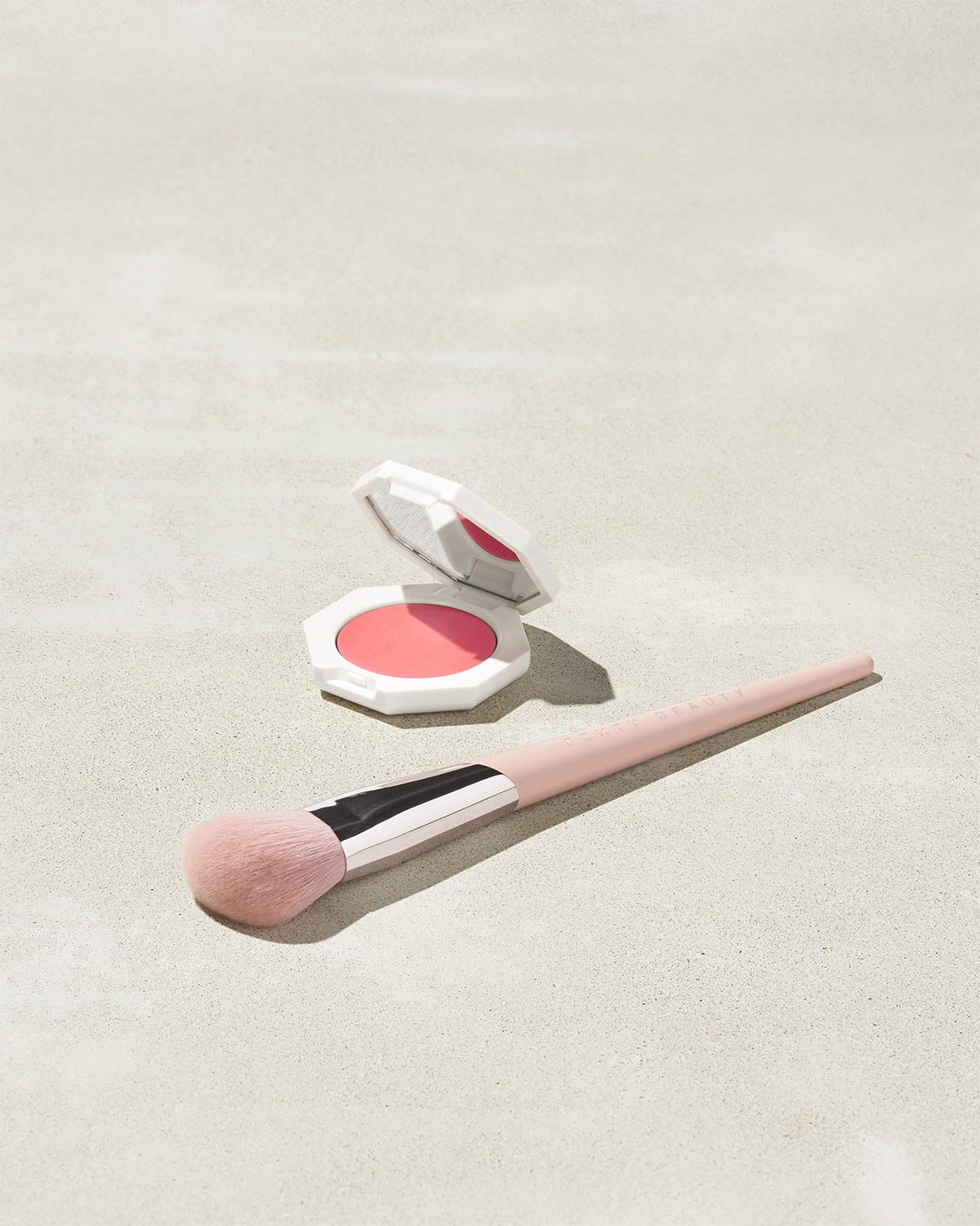 Cheeks Out Freestyle Cream Blush shown in shade Petal Poppin with Face Shaping Brush 125