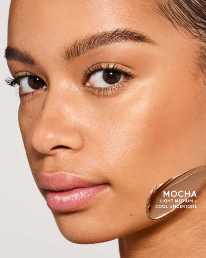 Medium skin toned model wearing match sti contour in shade mocha.