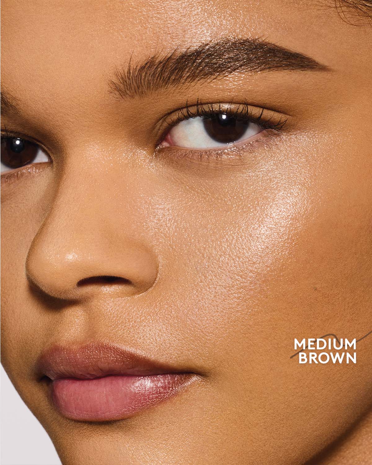 medium skin toned model wearing brow MVP in medium brown