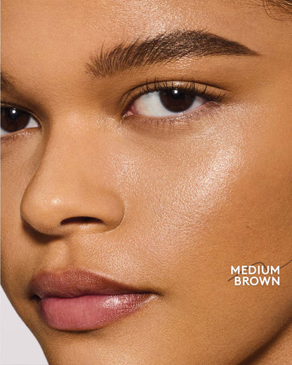 medium skin toned model wearing brow MVP in medium brown