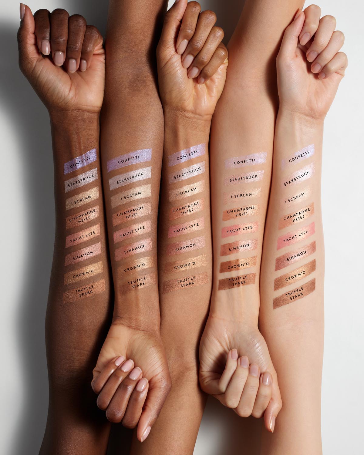 Arm swatch of Match Skin Shimmer Skinstick on light, light medium, medium, medium deep, and deep skin tones.