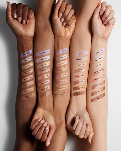 Arm swatch of Match Skin Shimmer Skinstick on light, light medium, medium, medium deep, and deep skin tones.