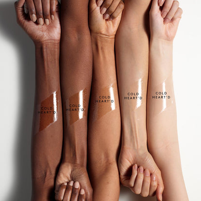 arm swatch of gloss bomb ice against deep, medium deep, medium, light medium, and light skin tones.