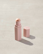 Match Stix Shimmer Skinstick shown in shade I Scream on a concrete background.