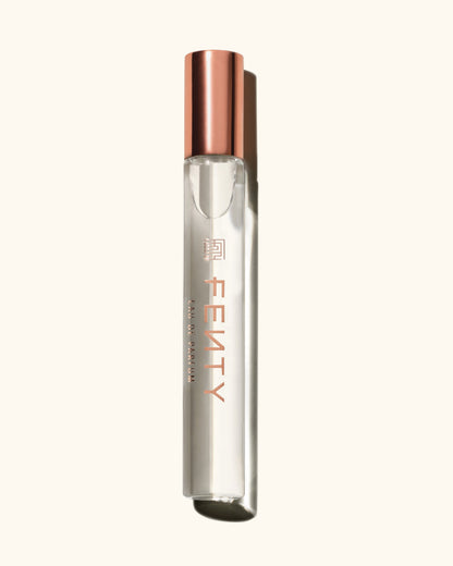 One travel size perfume bottle of the Fenty Eau de Parfum on a light background.