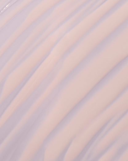 fat water milky smear on a lilac background