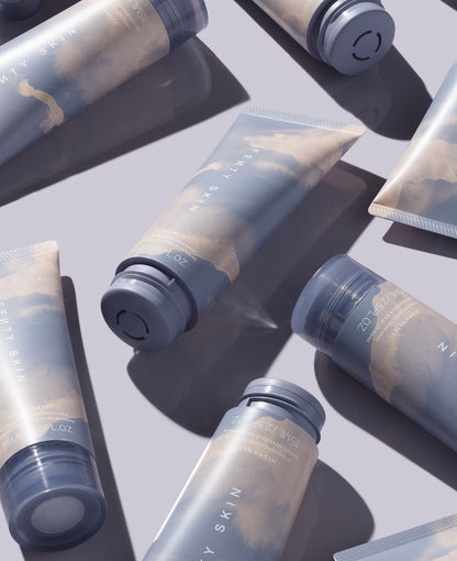editorial photo of Fenty Skin Hydra'Reset Intensive Recovery Glycerin Hand Mask tubes arranged on lavender background