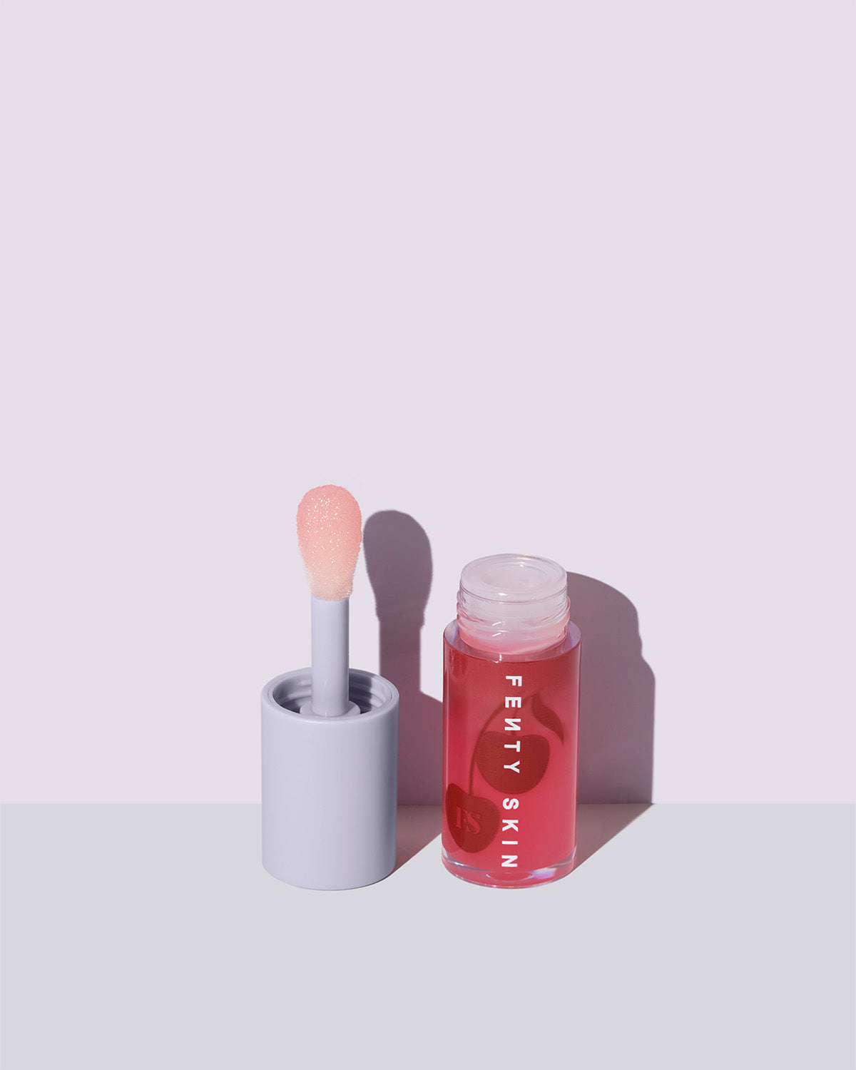 fenty treatz kalahari melon open on a lavender backround