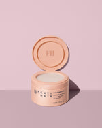 Open container showing The Homecurl Curl-Defining Cream